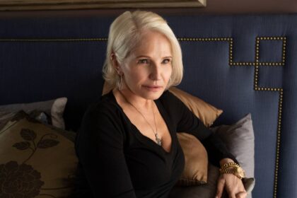 Ellen barkin as smurf sitting on a bed in animal kingdom.jpg