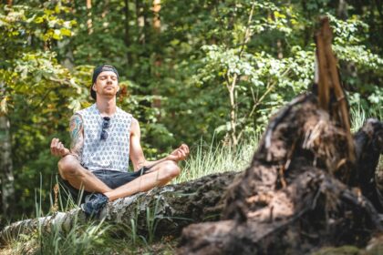 Person meditating in the woods.jpg