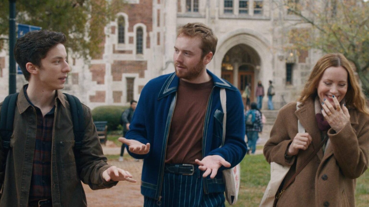 Andrew barth feldman and cooper hoffman and leslie mann walking and tallking on a college campus in.jpeg