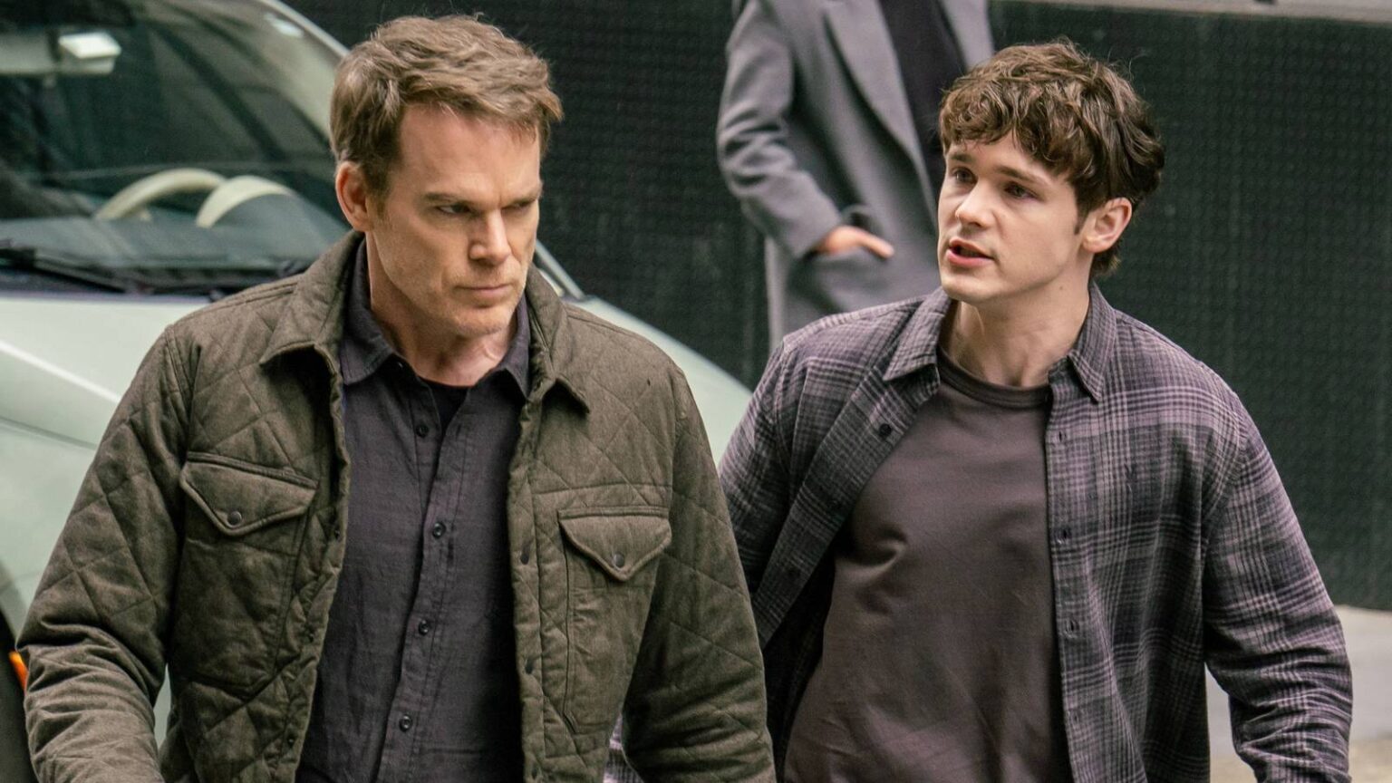 Dexter and harrison morgan walking in the street in dexter resurrection season 1.jpg