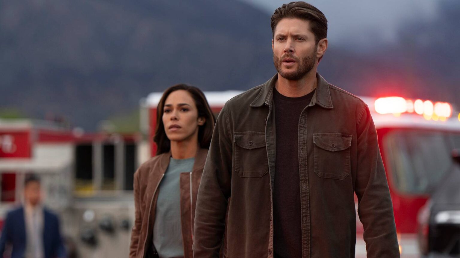 Jensen ackles meachum and jessica camacho s oliveras walking up to a crime scene looking intense in.jpeg
