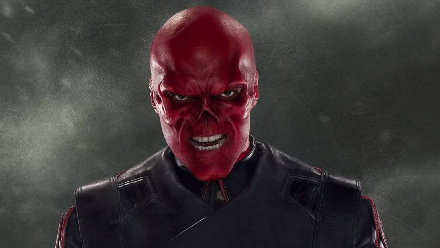 Red skull snarling against a grey backdrop.jpg
