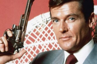 Roger moore as james bond holding his gun 1.jpg