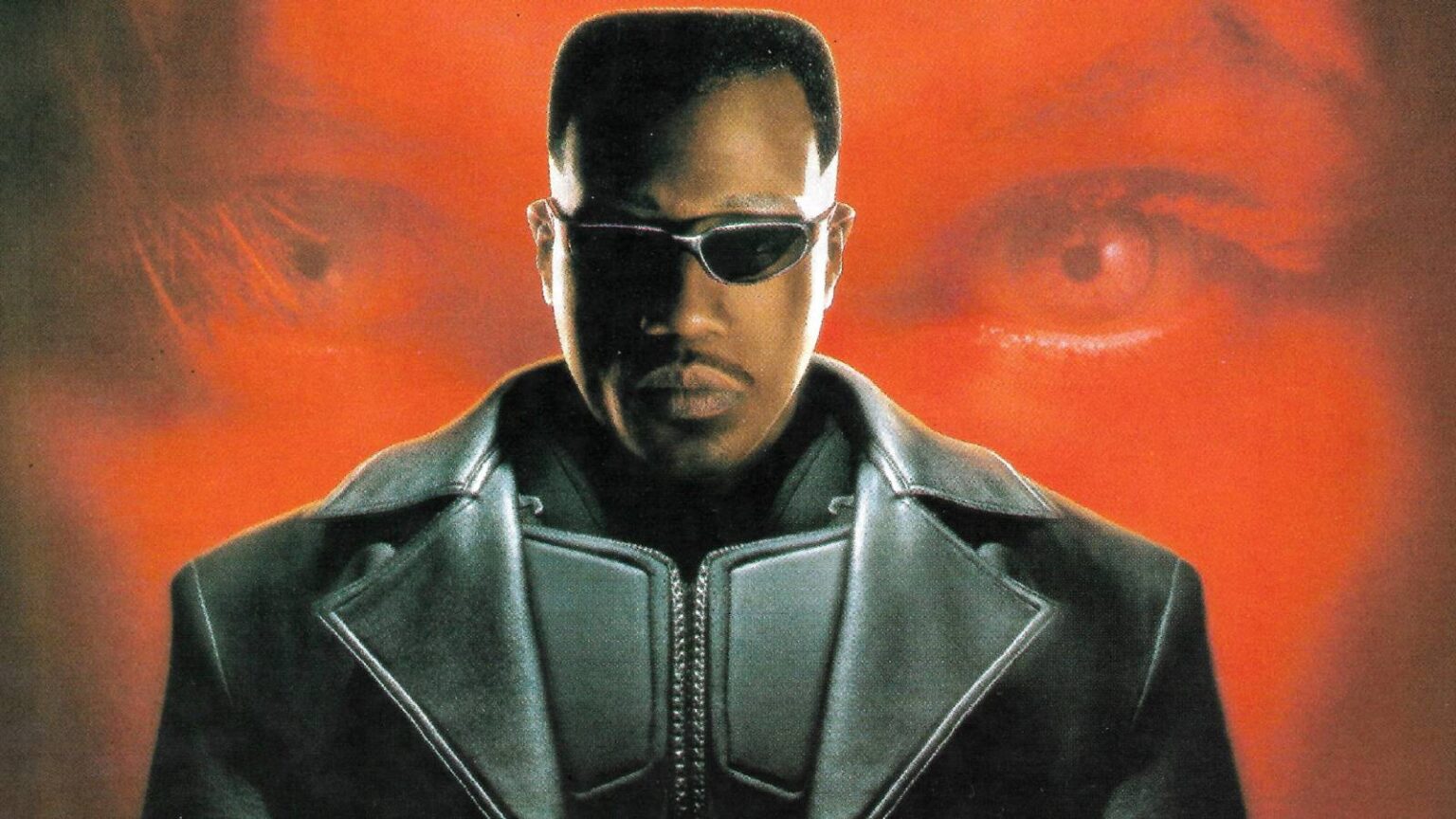 Wesley snipes looking into the camera as blade in front of a red background in poster for blade 1998.jpeg