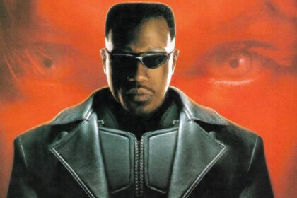 Wesley snipes looking into the camera as blade in front of a red background in poster for blade 1998.jpeg