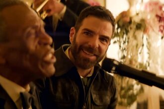 Zachary quinto smiles as a patient sings in brilliant minds.jpg