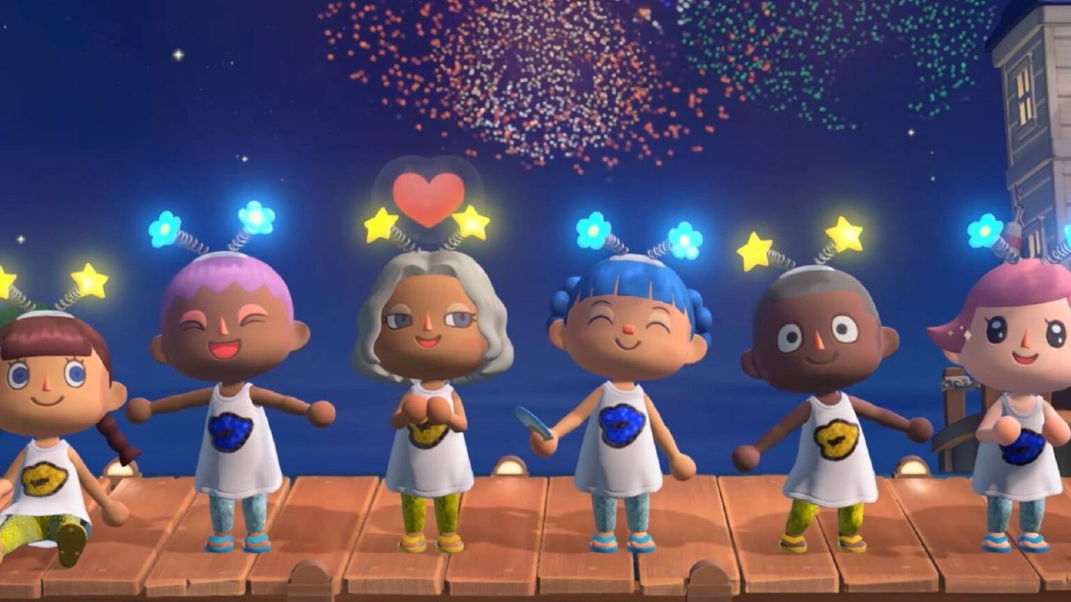 Animal crossing players lined up on a dock at night with fireworks in the sky behind them.jpg