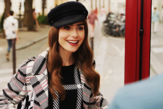 Lily collins smiling in a scene from emily in paris season 3.png