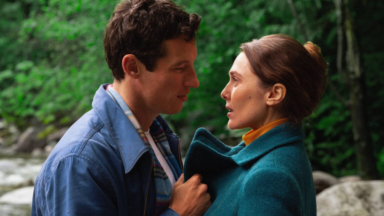 Miles teller and larry and elizabeth olsen as joan looking at each other in eternity.jpg