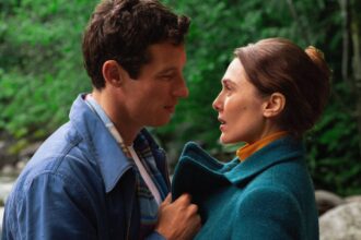 Miles teller and larry and elizabeth olsen as joan looking at each other in eternity.jpg