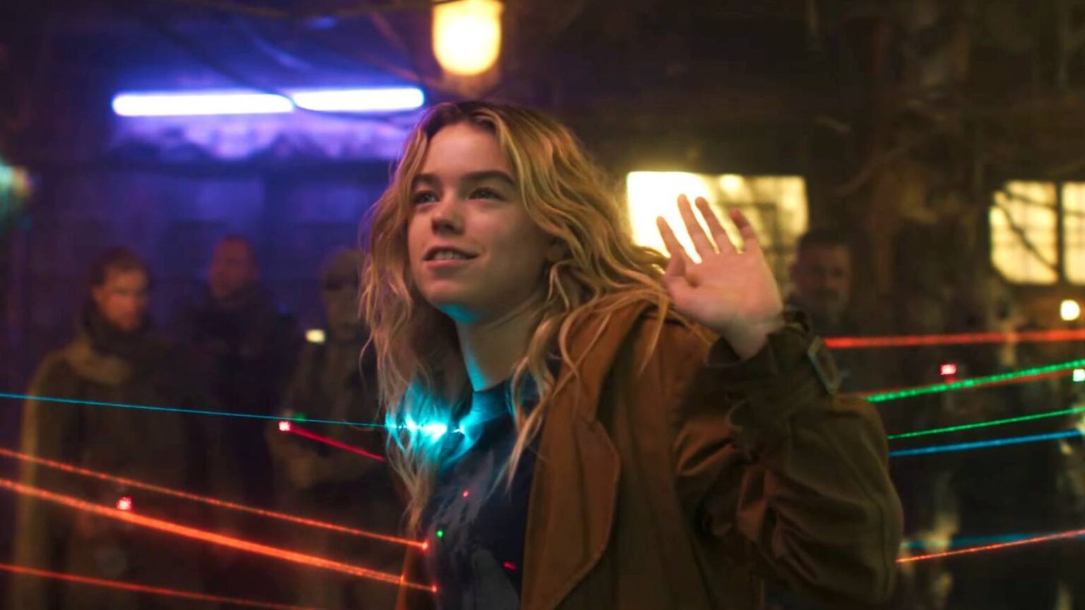 Milly alcock as supergirl with guns pointed at her.jpg