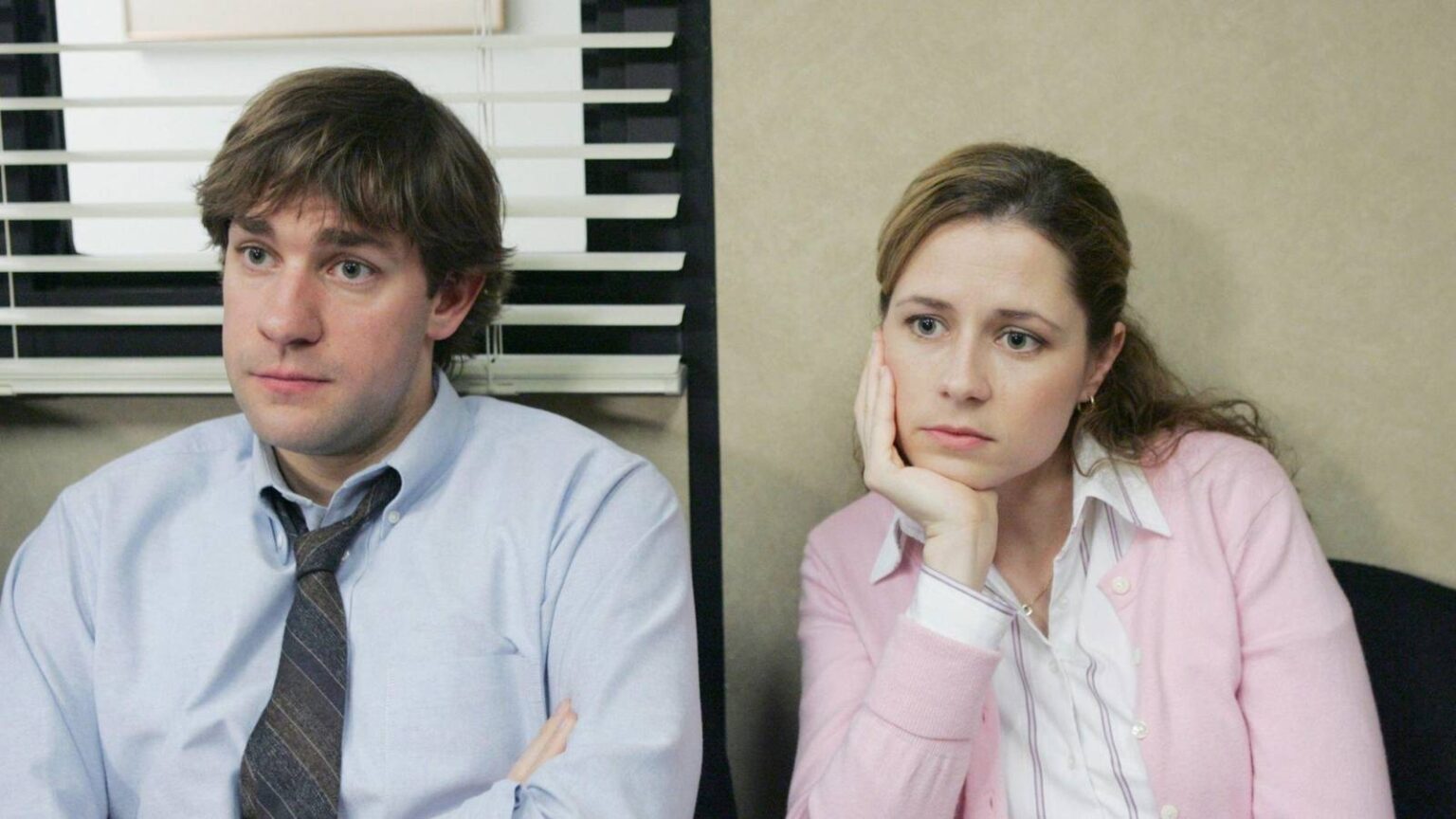 Jim and pam staring off into space at dunder mifflin in the office.jpg