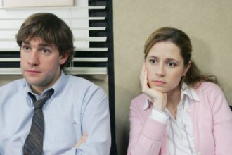 Jim and pam staring off into space at dunder mifflin in the office.jpg