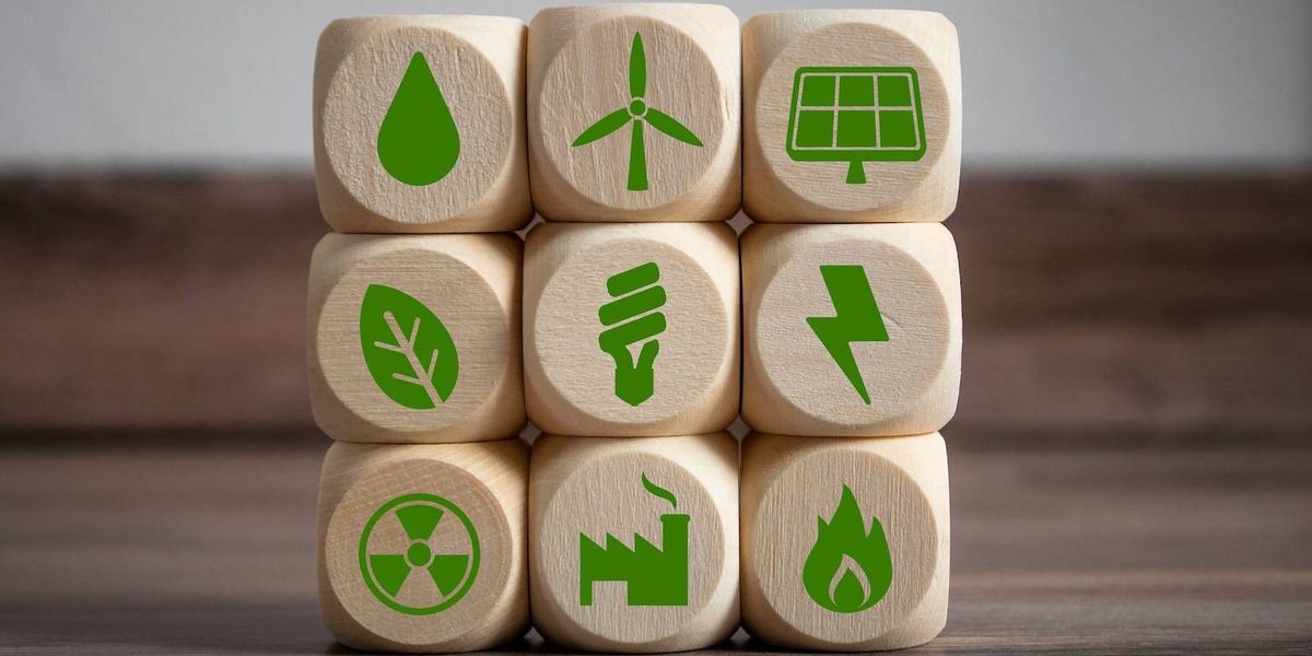 Wooden blocks with green energy and sustainability icons.jpg