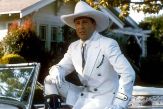 Bruce willis as tom mix dressed in a white cowboy outfit in sunset.jpg