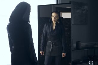 Chloe grace moretz looks in the mirror in the peripheral.jpeg