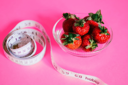 Healthy diet strawberries measuring tape.png
