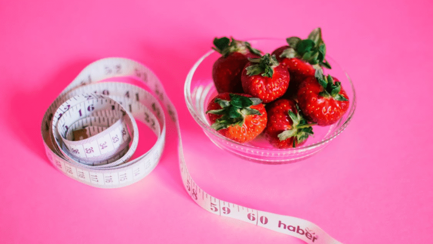 Healthy diet strawberries measuring tape.png