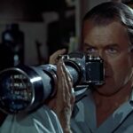 James stewart looking through a lens in rear window.jpg