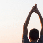 Man with hands air looking sky.png