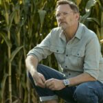 Matthew lillard crouches down in a field of corn in cross season 2.jpg