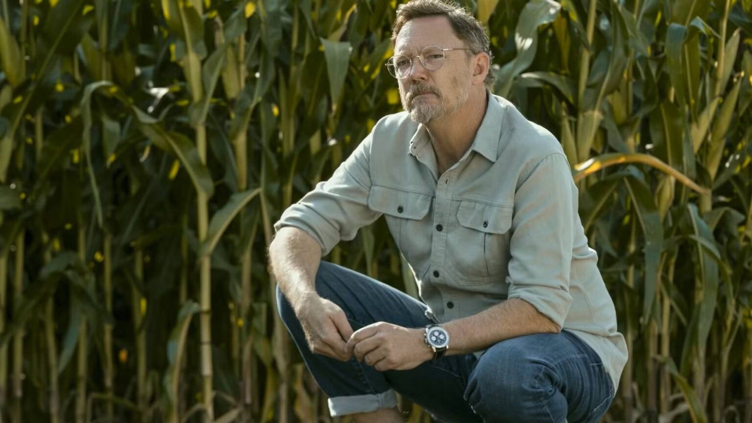 Matthew lillard crouches down in a field of corn in cross season 2.jpg