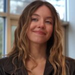 Sydney sweeney smiling in the housemaid.jpg