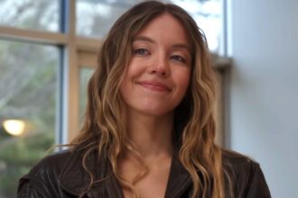 Sydney sweeney smiling in the housemaid.jpg