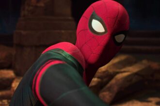 Tom holland s spider man looking back at doctor strange in spider man no way home.jpg