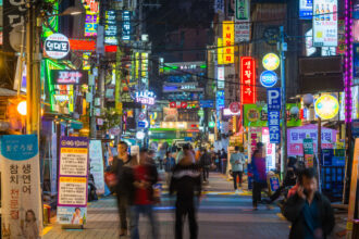 108095373 1738292856985 gettyimages 1507077883 seoulneonnightscrowdedshoppingstreetsdowntowncityscap.jpeg