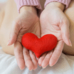 Heart in the hand of a woman.png