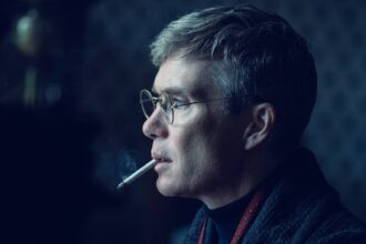 Cillian murphy as tommy shelby smoking a cigarette in peaky blinders the immortal man.jpg