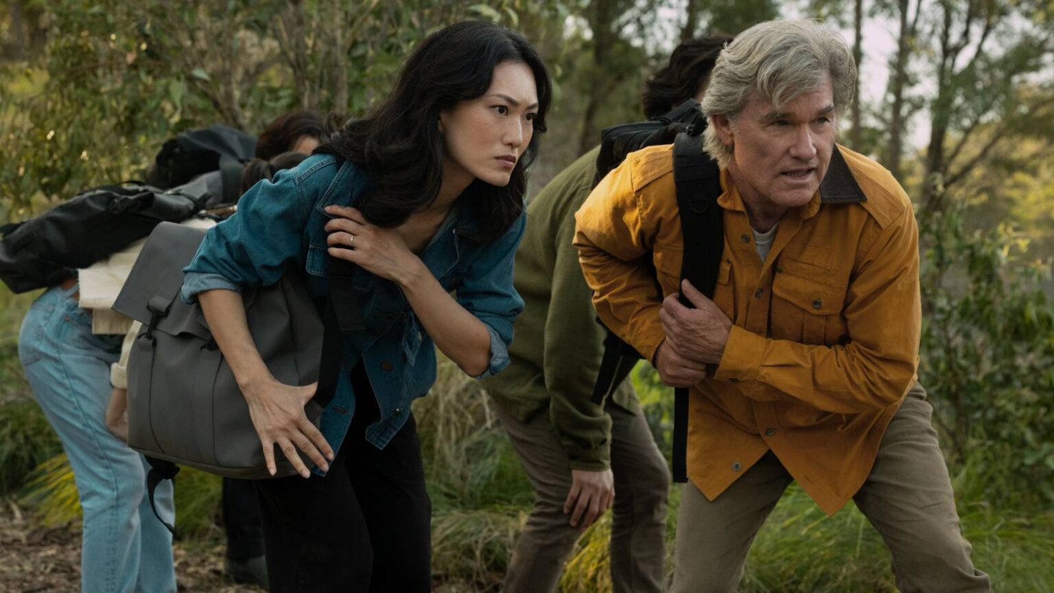 Keiko miura and lee shaw looking at something in the jungle in monarch legacy of monsters season 2.j.jpeg