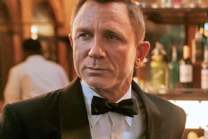 Daniel craig as james bond at a bar in no time to die.jpg