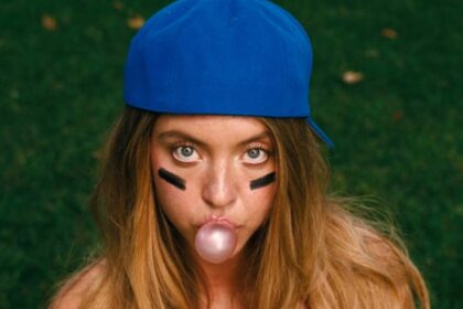 Sydney sweeney as cassie howard blowing a bubble and wearing a baseball cap in euphoria season 3.jpg