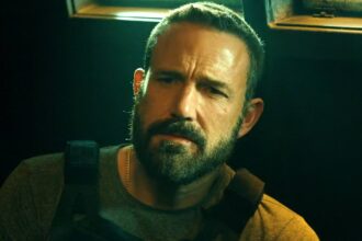 Ben affleck looking sternly at steven yeun in the rip.jpg