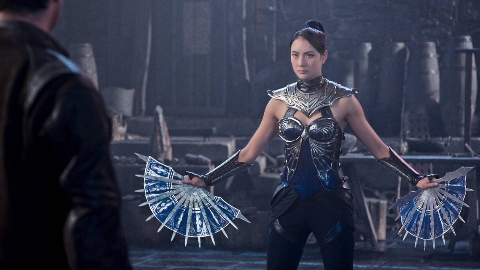 Kitana brandishing her blade fans against johnny cage in mortal kombat ii.jpg