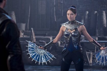 Kitana brandishing her blade fans against johnny cage in mortal kombat ii.jpg