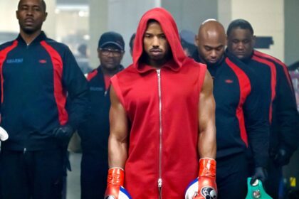 Michael b jordan looking glum in a red hoodie in creed 2.jpg