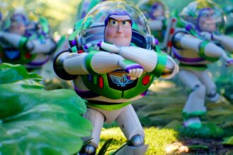 Buzz lightyear leading a team of buzzes through a forest in toy story 5.jpg