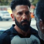 Frank castle listenening to a heartbroken civilian in punisher one last kill 1.jpg