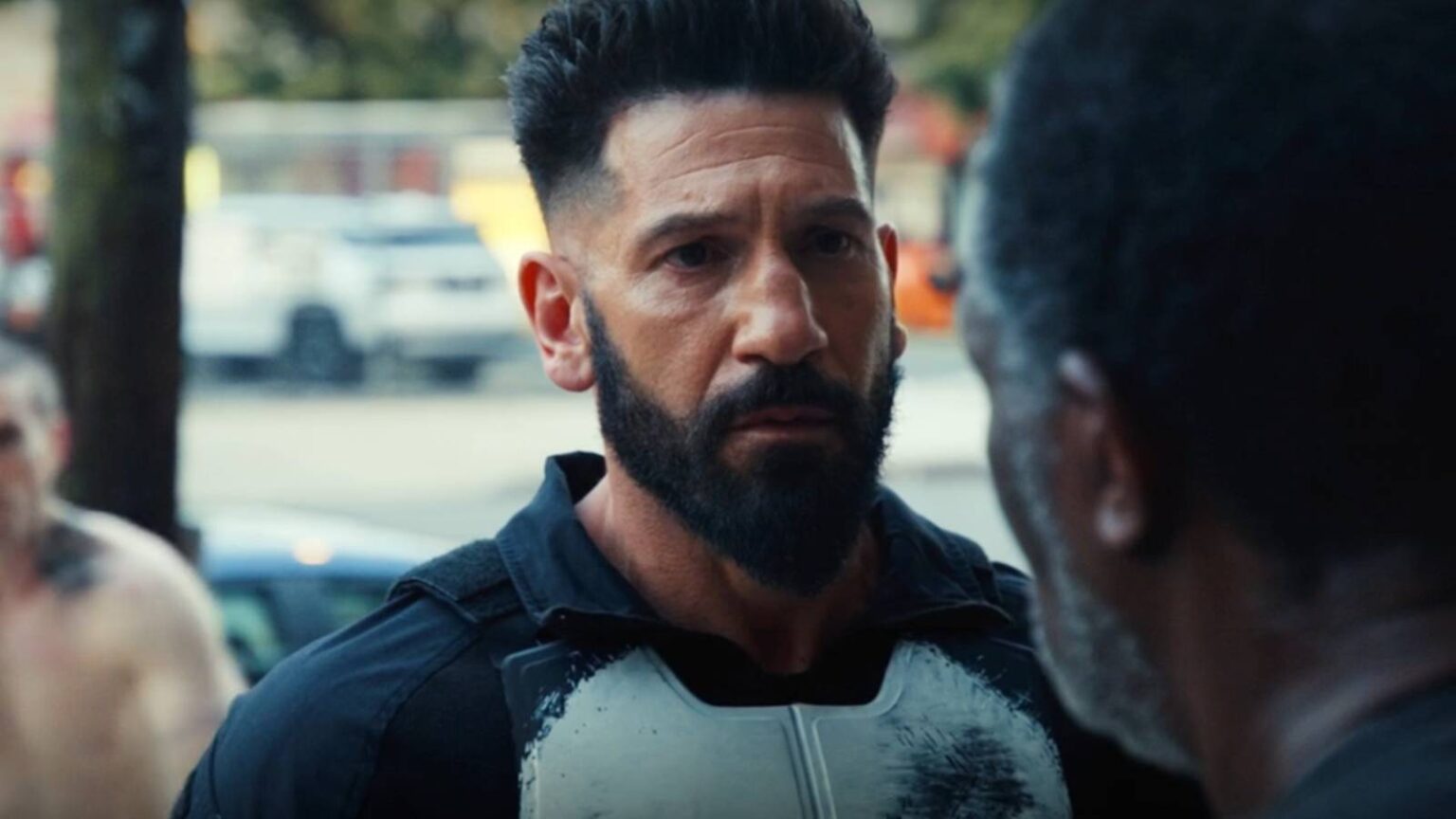 Frank castle listenening to a heartbroken civilian in punisher one last kill 1.jpg