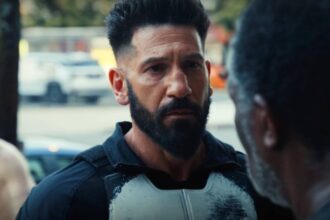 Frank castle listenening to a heartbroken civilian in punisher one last kill 1.jpg